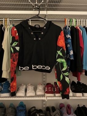 bebe Black Cropped Hoodie with Red Floral Sleeves